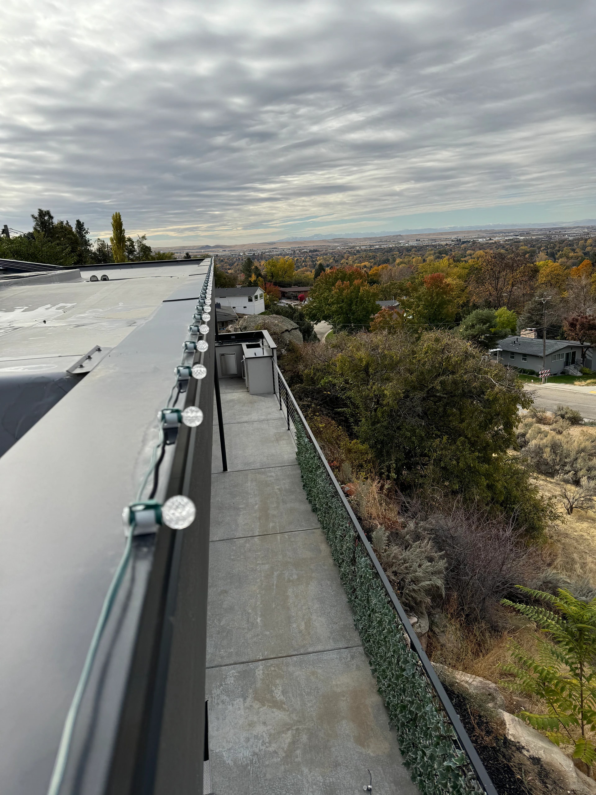 Hillside patio Christmas light installation with a valley view in Boise, ID by Christmas Light Installation Boise