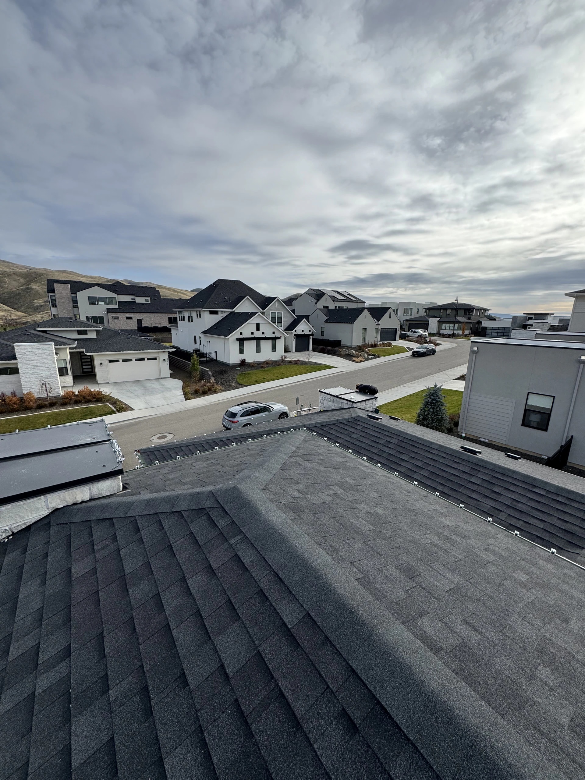 Neighborhood roofline Christmas light install from a roof peak in Boise, ID by Christmas Light Installation Boise