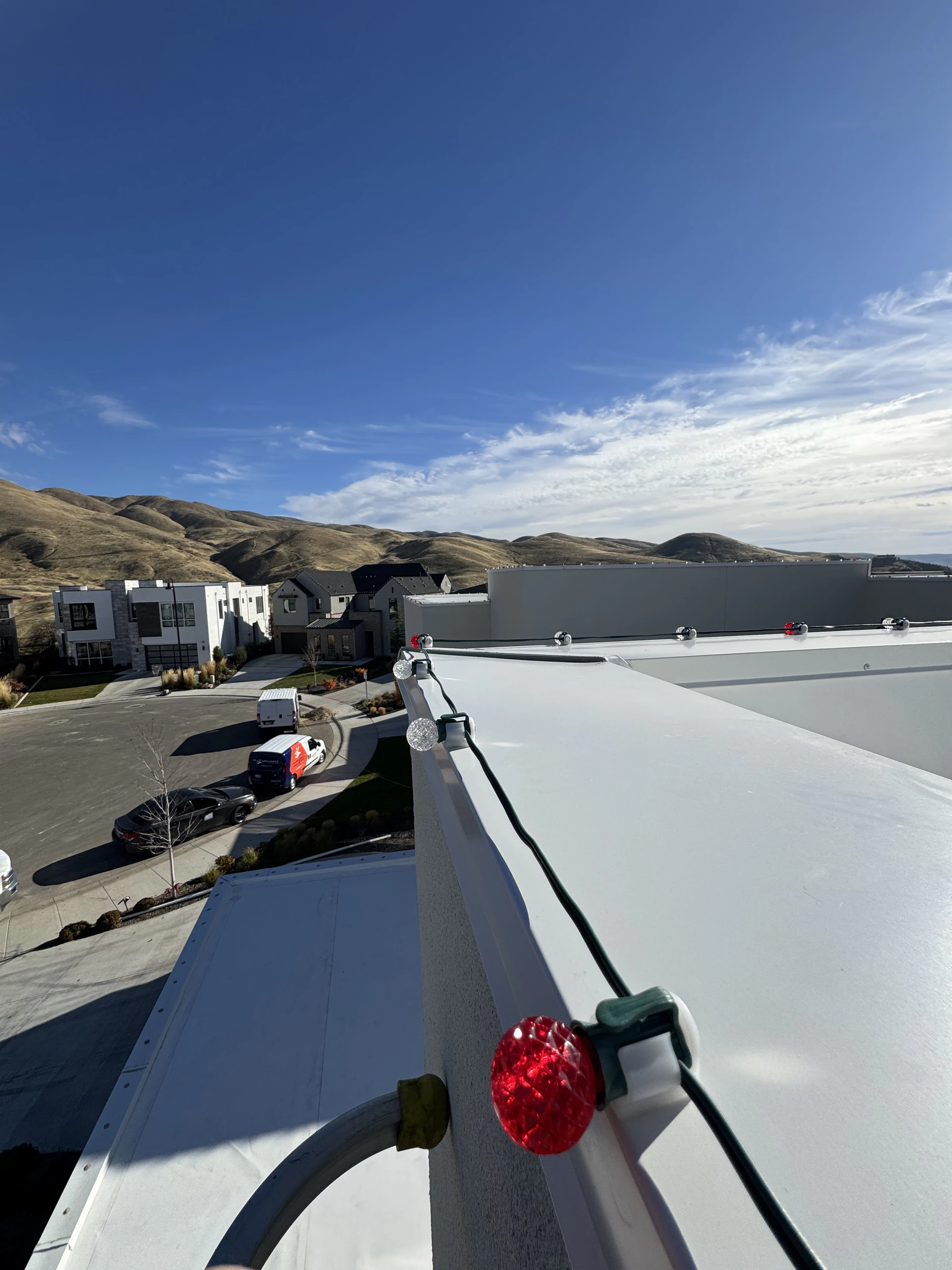 Rooftop Christmas light installation on a modern flat-roof home in Boise, ID by Christmas Light Installation Boise