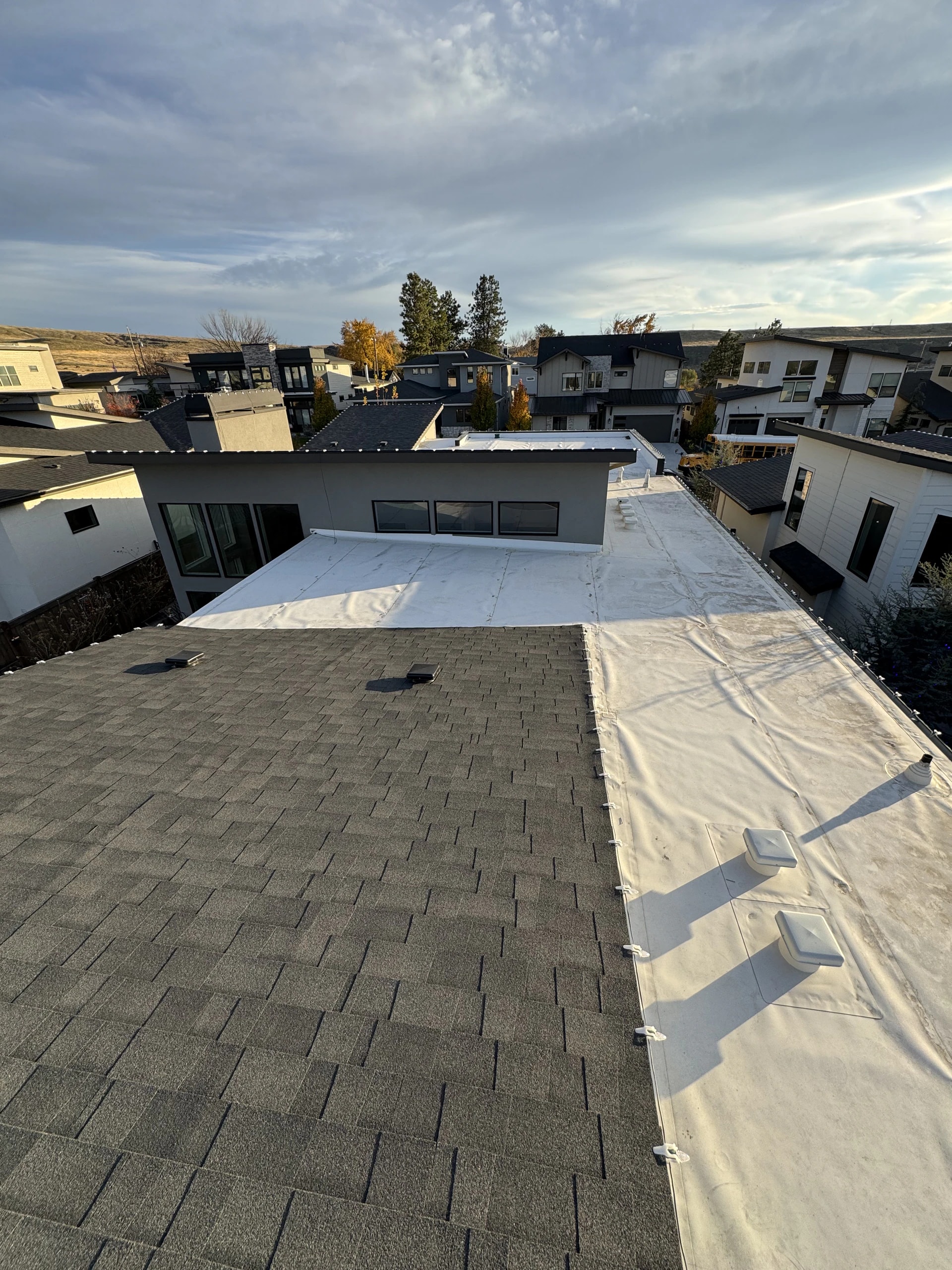 Rooftop Christmas light layout on a modern mixed-roof home in Boise, ID by Christmas Light Installation Boise